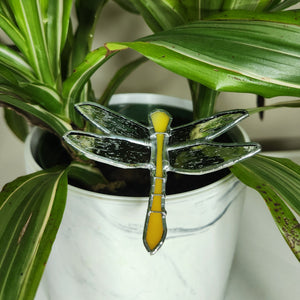 Dragonfly Plant Stake - Sugar & Spice. Yellow-orange dragonfly displayed in a potted plant